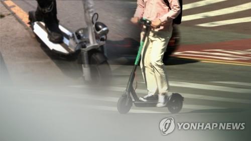 This image filed on March 11, 2020, shows people riding e-scooters. (Yonhap) 