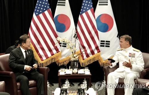 South Korean President Moon Jae-in (L) meets with Adm. John C. Aquilino, commander of the U.S. Indo-Pacific Command, at Hickam Air Force Base in Honolulu on Sept. 22, 2021. (Yonhap)