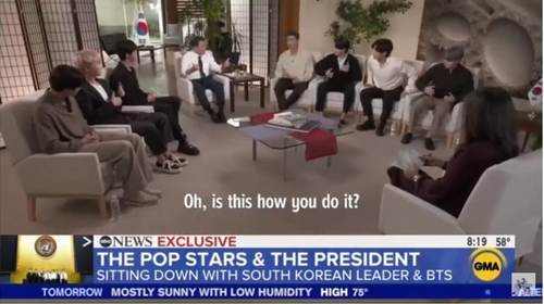 South Korean President Moon Jae-in (4th from L) and seven members of South Korean superband BTS are seen doing a dance move from BTS' hit song "Permission to Dance" during an interview with U.S. TV network ABC, aired Sept. 24, 2021, in this image captured from ABC's YouTube channel. (PHOTO NOT FOR SALE) (Yonhap)