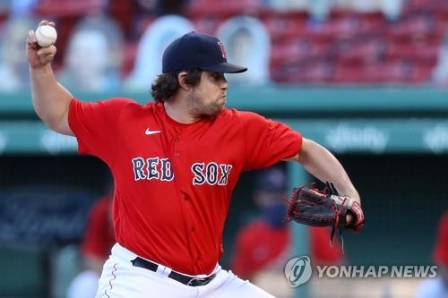 In this Getty Images file photo from Sept. 4, 2020, Robert Stock of the Boston Red Sox pitches against the Toronto Blue Jays in the top of the seventh inning of a Major League Baseball regular season game at Fenway Park in Boston. (Yonhap)