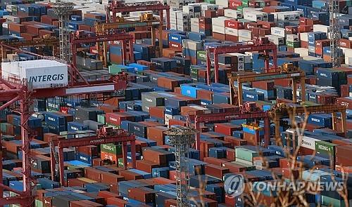 Shipping containers are stacked at a port in the southeastern city of Busan, in this file photo taken Jan. 1, 2024. (Yonhap)