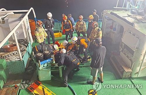Rescued crew members are taken to a nearby port after their fishing boat sank off the coast of Jeju Island on Nov. 8, 2024, in this photo provided by the Jeju firefighting and safety headquarters. (PHOTO NOT FOR SALE) (Yonhap) 