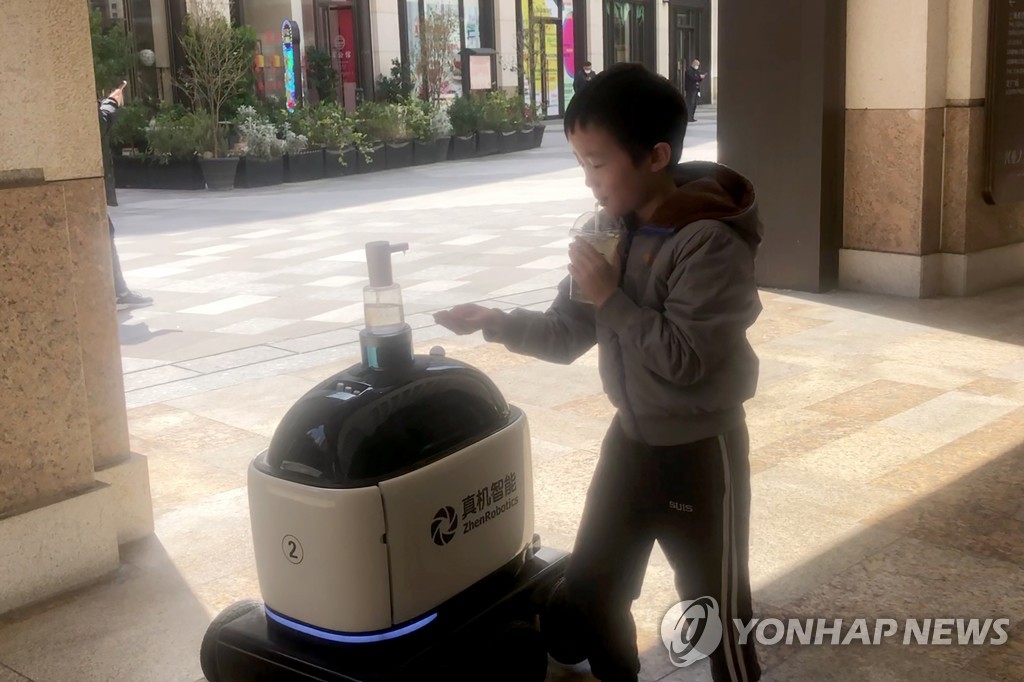 Virus Outbreak China Robot Maker