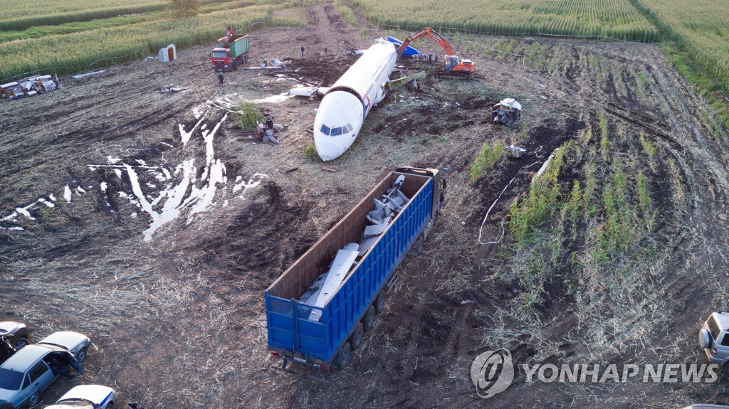 Dismantling Airbus A321 jet at crash landing site near Zhukovsky Airport