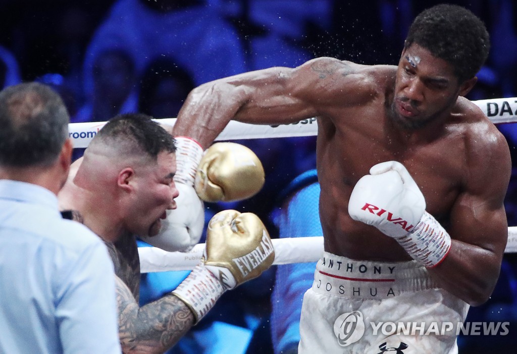 British boxer Anthony Joshua wins back his world heavyweight titles in Saudi Arabia