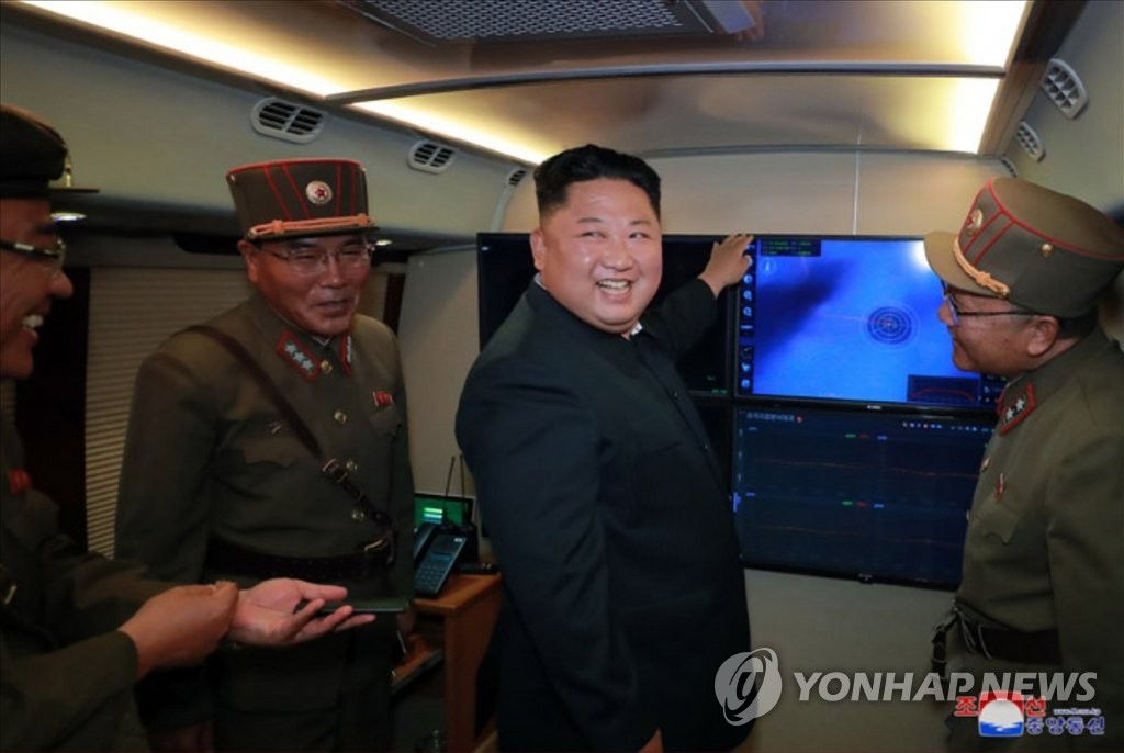 N.K. leader Kim oversees rocket launcher test N.K. leader Kim oversees rocket launcher test