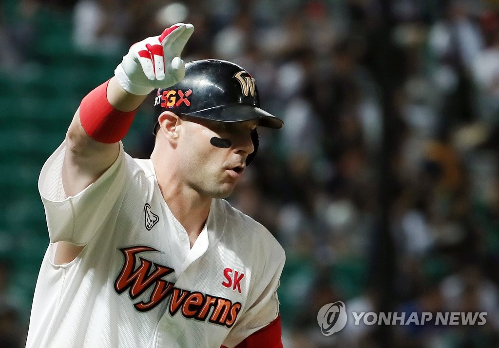 In this file photo from Sept. 19, 2019, Jamie Romak of the SK Wyverns celebrates his 100th Korea Baseball Organization (KBO) home run in the bottom of the second inning of a KBO regular season game against the Doosan Bears at SK Happy Dream Park in Incheon, 40 kilometers west of Seoul. (Yonhap)