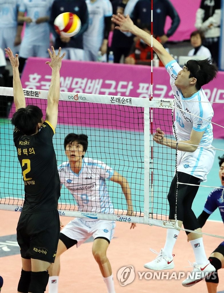 Korean Air player spikes the ball Korean Air player spikes the ball