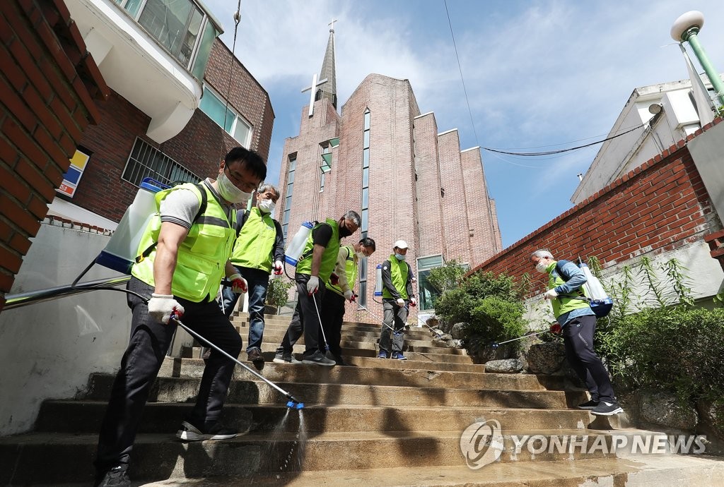 This photo, from June 1, 2020, shows health workers disinfecting a church in Suwon, south of Seoul, where infections occurred in relation to the Coupang logistics center in Bucheon, west of Seoul. (Yonhap)