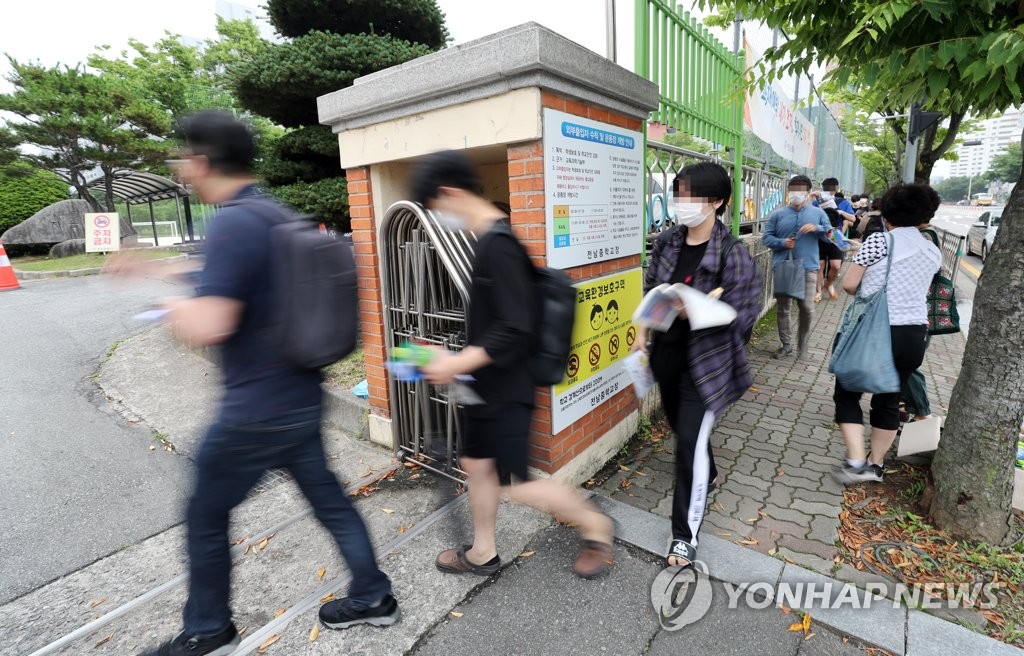 Applicants take public servant test amid coronavirus pandemic Applicants take public servant test amid coronavirus pandemic