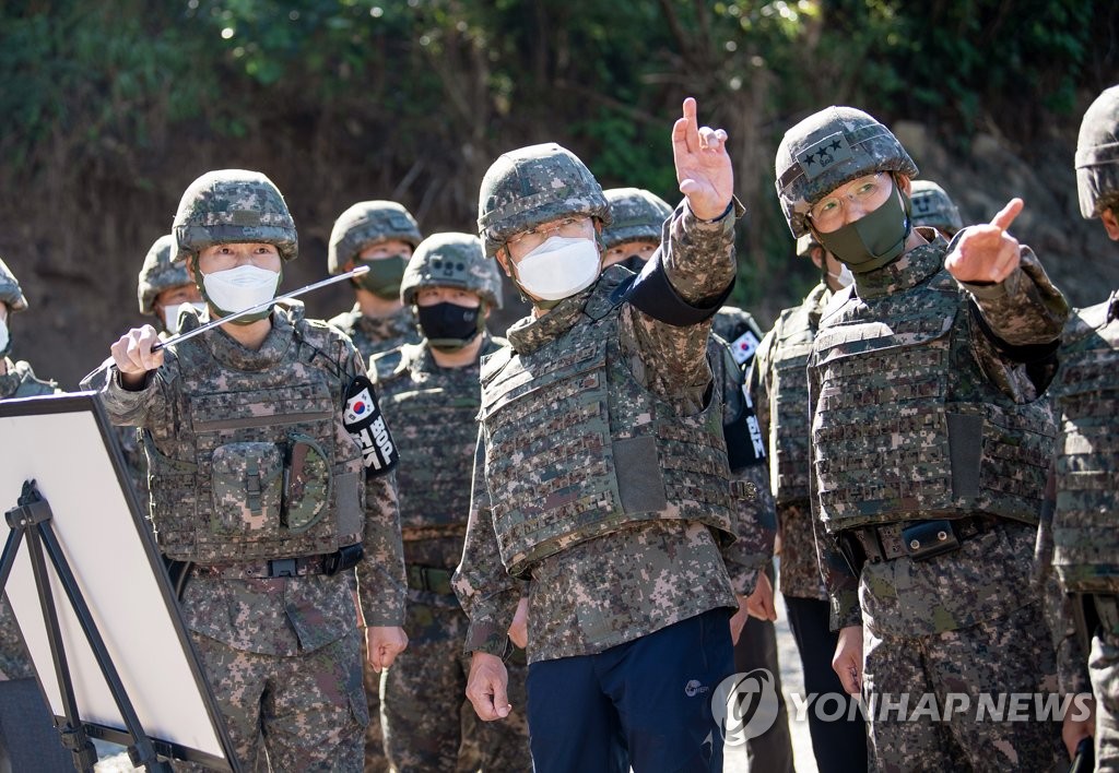 Defense chief at former battlefield Defense chief at former battlefield