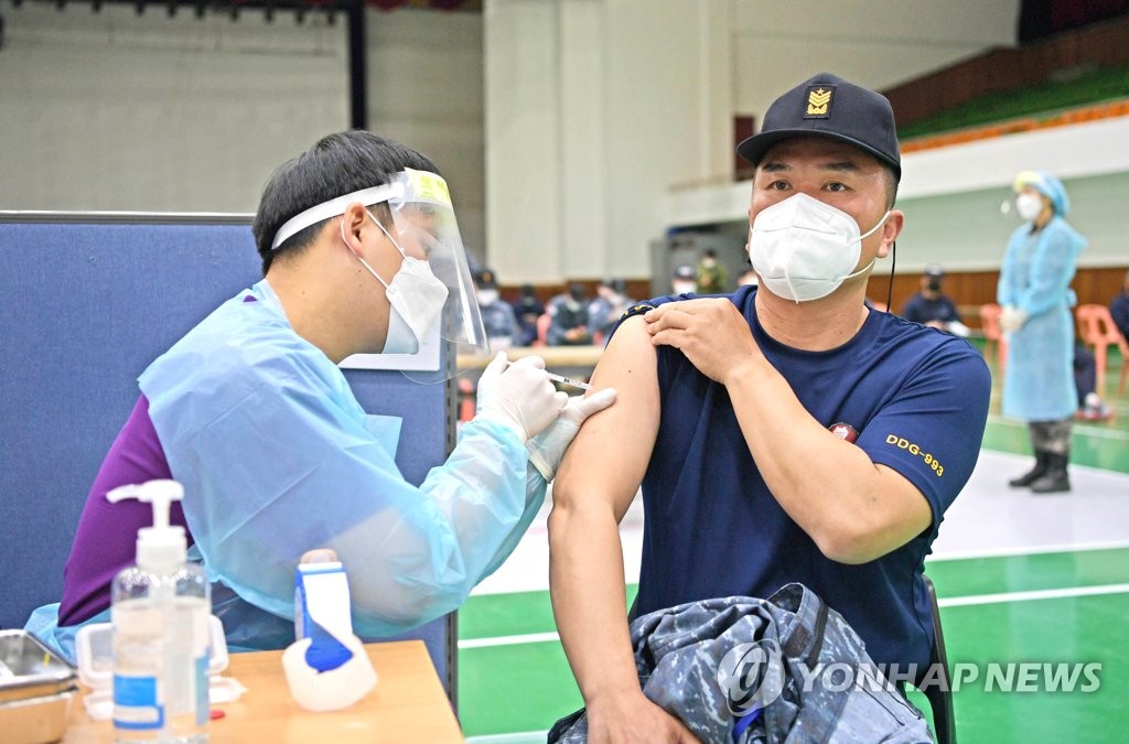 A Navy officer receives the first jab of AstraZeneca's COVID-19 vaccine at a vaccination center at a Naval base in Jinhae on the southeastern coast on April 28, 2021, in this photo provided by the South Korean defense ministry. (PHOTO NOT FOR SALE) (Yonhap)