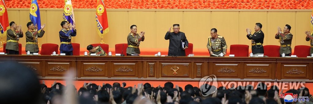 North Korean leader Kim Jong-un (C) attends the first-ever workshop of military commanders and political officers in Pyongyang, in this photo released by the North's official Korean Central News Agency on July 30, 2021. At the workshop, which ran from July 24 through 27, Kim made no mention of nuclear weapons or relations with South Korea or the United States. (For Use Only in the Republic of Korea. No Redistribution) (Yonhap)