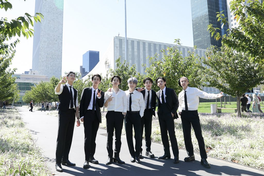 This photo, provided by Big Hit Music on Sept. 21, 2021, shows K-pop sensations BTS posing in front of the U.N. headquarters. BTS addressed the U.N. General Assembly on Sept. 20, and played a video of the septet performing "Permission to Dance," in and outside the U.N. headquarters. (PHOTO NOT FOR SALE) (Yonhap)