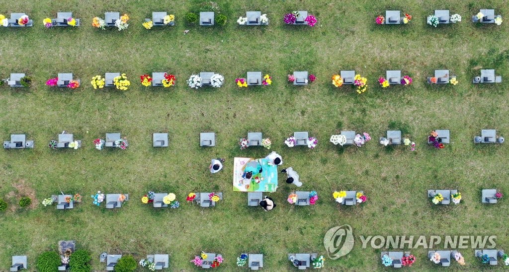Family visit grave of loved one during Chuseok Family visit grave of loved one during Chuseok