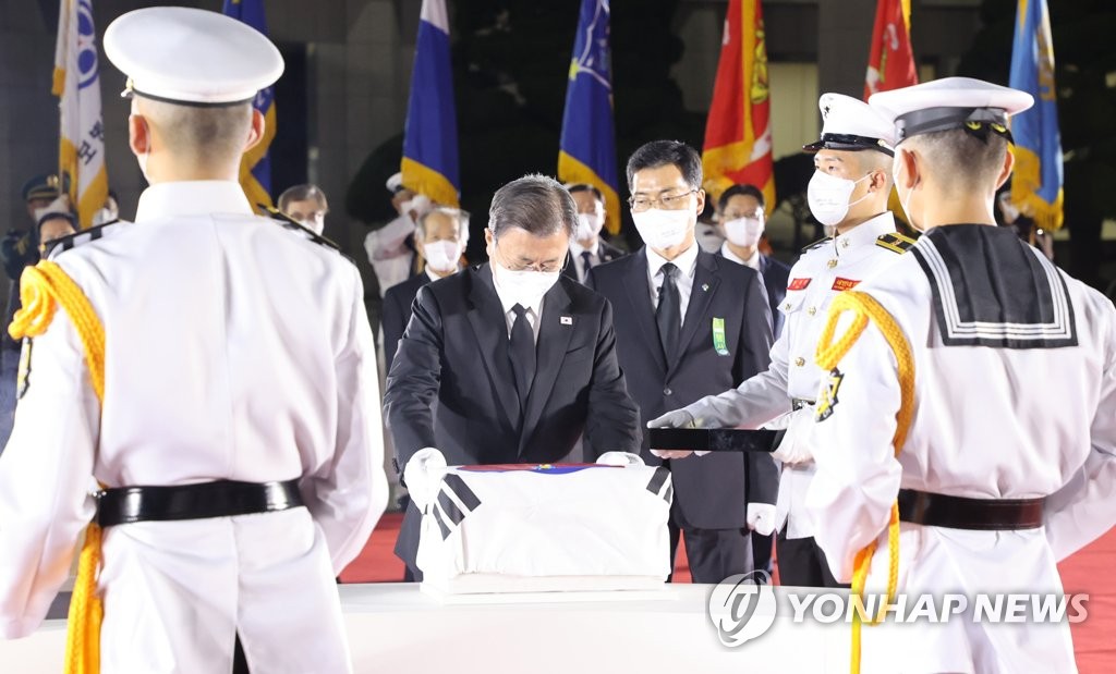 Moon at repatriation ceremony Moon at repatriation ceremony