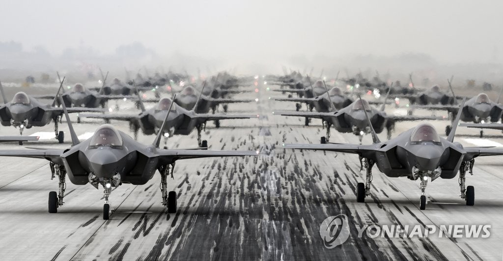 This photo, provided by the defense ministry, shows the South Korean Air Force's F-35A stealth fighters performing an elephant walk under the command of Defense Minister Suh Wook at an unidentified air base on March 25, 2022, to show the country's combat readiness following North Korea's intercontinental ballistic missile (ICBM) test the previous day. (PHOTO NOT FOR SALE) (Yonhap)