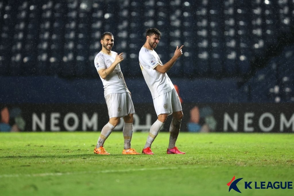 In this April 30, 2022, file photo provided by the Korea Professional Football League, Zeca of Daegu FC (R) celebrates his goal against Lion City Sailors during the clubs' Group F match at the Asian Football Confederation Champions League at Buriram Stadium in Buriram, Thailand. (PHOTO NOT FOR SALE) (Yonhap)