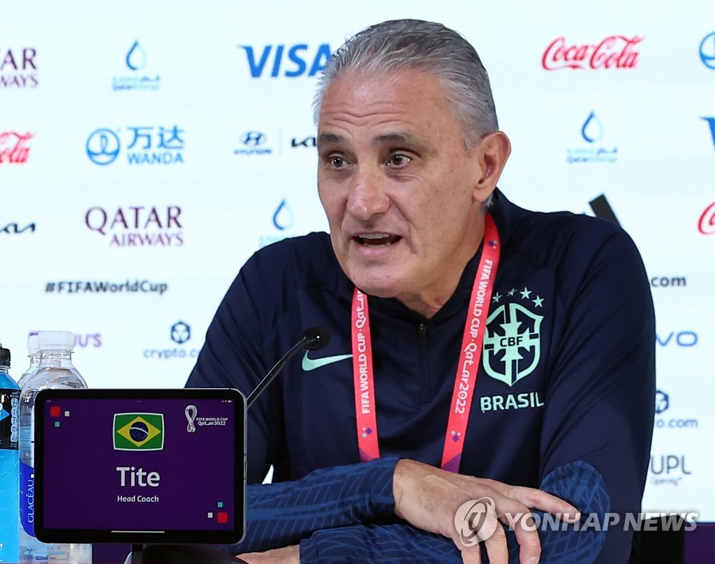 Brazil head coach Tite speaks at a press conference at the Main Media Centre for the FIFA World Cup in Al Rayyan, west of Doha, on Dec. 4, 2022, the eve of his team's round of 16 match against South Korea. (Yonhap)