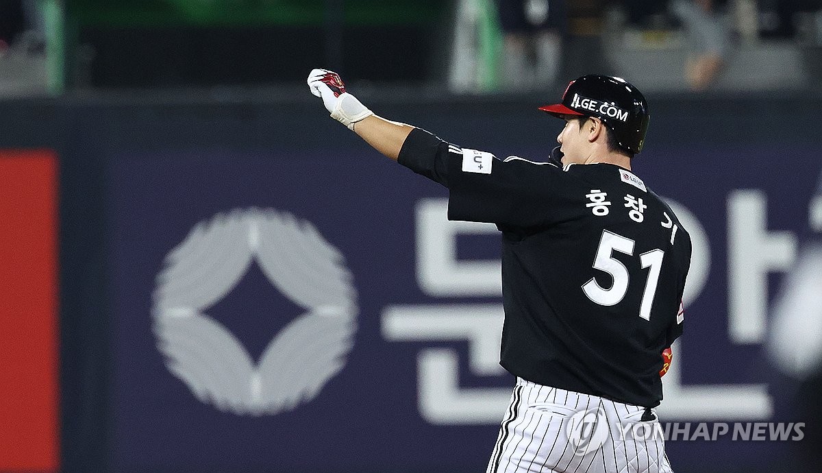 Hong Chang-ki of the LG Twins celebrates after hitting an RBI double against the KT Wiz during Game 3 of the first round in the Korea Baseball Organization postseason at KT Wiz Park in Suwon, Gyeonggi Province, on Oct. 8, 2024. (Yonhap)