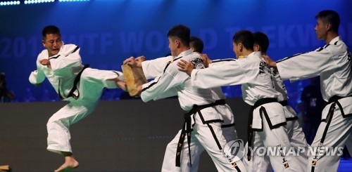 North Korean taekwondo demonstrators from the International Taekwondo Federation (ITF) perform during the opening ceremony of the World Taekwondo Federation (WTF) World Taekwondo Championships at T1 Arena in Muju, North Jeolla Province, on June 24, 2017. This was the first performance by an ITF demonstration team at a WTF event held in South Korea. (Yonhap)