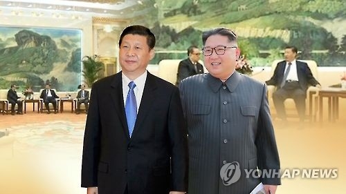 A combined image of Chinese President Xi Jinping (L) and North Korean leader Kim Jong-un in a photo provided by Yonhap News TV (Yonhap)