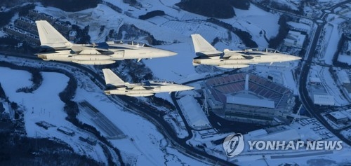 FA-50 fighters fly over the main venue for the upcoming PyeongChang Winter Olympics on Jan. 1, 2018, in this photo released by the Air Force. (Yonhap)