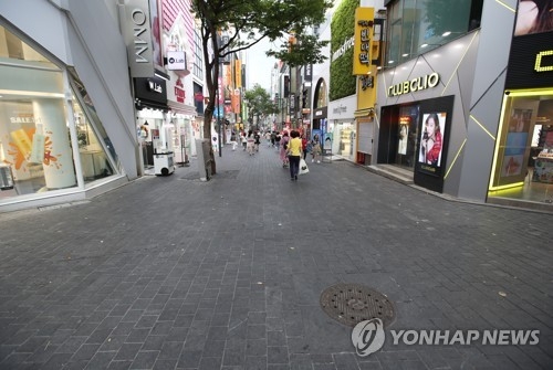This undated file photo shows a relatively empty Myeongdong shopping district in Seoul. (Yonhap)