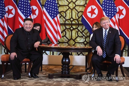 This AFP photo shows North Korean leader Kim Jong-un and U.S. President Donald Trump seated together at the Sofitel Legend Metropole Hanoi hotel on Feb. 28, 2019. (Yonhap)
