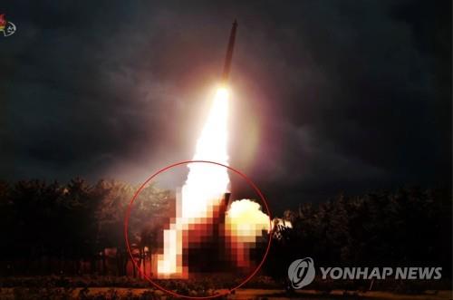 This blurred photo, captured from the North's Korean Central TV on Aug. 1, 2019, shows the North's newly-developed large-caliber multiple launch guided rocket system. The system was test-fired the previous day. (For Use Only in the Republic of Korea. No Redistribution) (Yonhap)