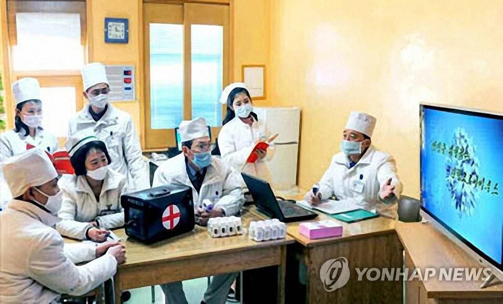 North Korea's public health officials hold a meeting on the COVID-19 virus in this photo captured from the Rodong Sinmun on Feb. 23, 2020. (PHOTO NOT FOR SALE) (Yonhap)