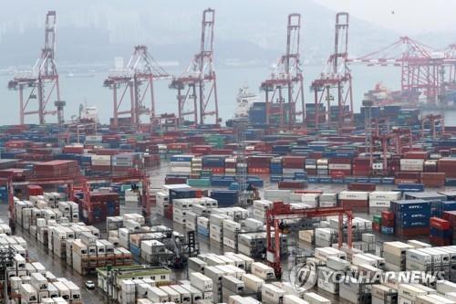 Cargo containers are stacked at a port in South Korea's southeastern city of Busan on Dec. 1, 2019. (Yonhap)