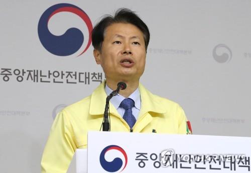 Vice Health Minister Kim Ganglip speaks during a press conference at the government complex in Sejong, central South Korea, on March 9, 2020, about the spread of the new coronavirus that has hit the country.