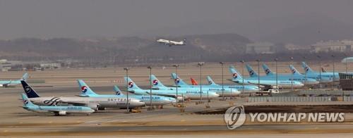 This photo, taken on March 17, 2020, shows Korean Air Lines' planes parked at Incheon International Airport, west of Seoul, amid the coronavirus outbreak. (Yonhap) 