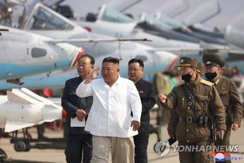 North Korean leader Kim Jong-un (C) inspects a pursuit assault plane group under the Air and Anti-Aircraft Division in the western area in this photo released on April 12, 2020, by the North's official Korean Central News Agency. (For Use Only in the Republic of Korea. No Redistribution) (Yonhap)