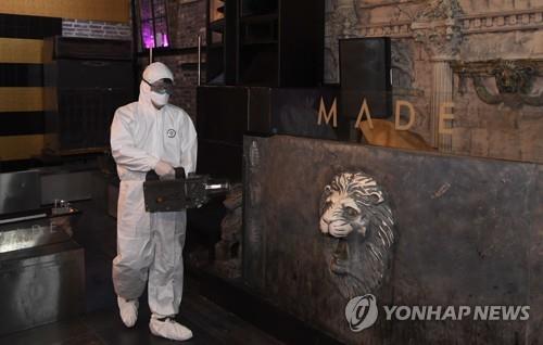 A worker disinfects a nightclub in the Itaewon area of Seoul on May 12, 2020. (Yonhap)