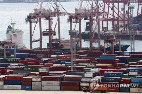This undated file photo shows containers carrying export goods in the southeastern city of Busan, South Korea's largest seaport. (Yonhap)