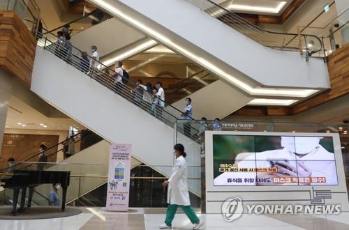 A doctor walks inside of a Seoul hospital on Aug. 27, 2020, the second day of a three-day strike by tens of thousands of doctors nationwide in protest of the government's medical workforce reform. The walkout, the second of its kind, was organized by the Korean Medical Association, which has some 130,000 members. (Yonhap)
