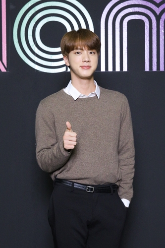 This photo, provided by Big Hit Entertainment on Sept. 2, 2020, shows member Jin of K-pop sensation BTS posing for photos during an online press conference to celebrate the band's single "Dynamite" debuting at No. 1 on the Billboard Hot 100 chart. (PHOTO NOT FOR SALE) (Yonhap)