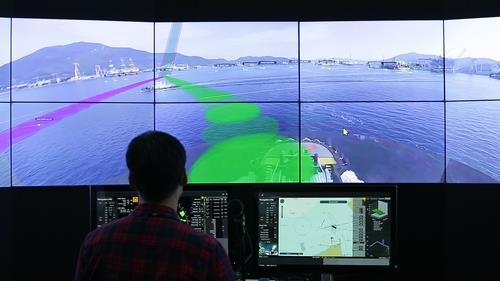 This file photo, provided by Samsung Heavy Industries Co. on Oct. 19, 2020, shows a person controlling the company's remote autonomous ship in seas off Geoje Island via a remote control system at a research center in Daejeon, 250 kilometers away from the seas. (PHOTO NOT FOR SALE) (Yonhap)