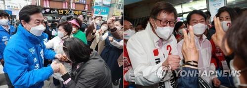 Kim Young-choon, the Democratic Party&apos;s Busan mayoral candidate (L), and his rival from the People Power Party Park Heong-joon rally support in Busan on April 1, 2021. (Yonhap)