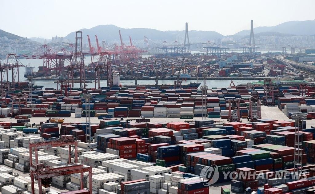 Cargo containers are stacked at a port in Busan, 453 kilometers southeast of Seoul, on June 1, 2021, in this file photo. (Yonhap)