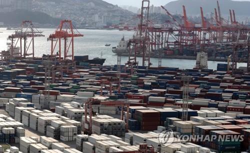 This file photo, taken Nov. 11, 2021, shows containers stacked at a pier in South Korea's largest port city of Busan. (Yonhap)