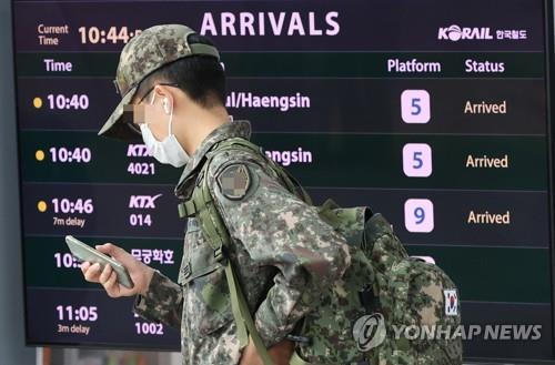 In this file photo, a service member walks at Seoul Station in central Seoul on April 29, 2022. (Yonhap)