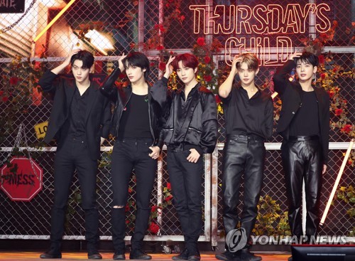 In this photo provided by Big Hit Music, K-pop boy group Tomorrow X Together poses for the camera during a press conference in Seoul on May 9, 2022, for its fourth EP "minisode 2: Thursday's Child." (PHOTO NOT FOR SALE) (Yonhap)