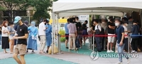 S. Korea's new COVID-19 cases below 100,000 for 2nd day; critical cases at 4-month high