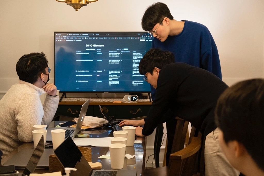 This photo provided by DelightRoom Co. shows the company's officials. (PHOTO NOT FOR SALE) (Yonhap)
