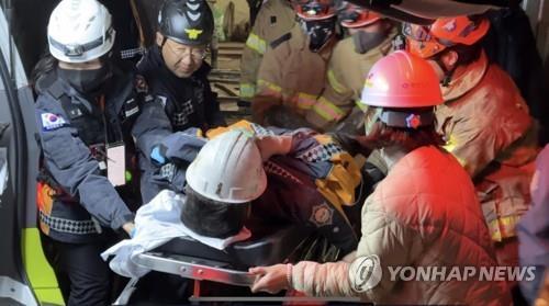 This photo provided by fire authorities shows a miner being carried into a hospital on Nov. 4, 2022, after being rescued from a collapsed mine nine days after being trapped. (PHOTO NOT FOR SALE) (Yonhap)