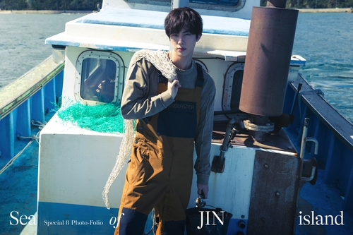 This image provided by Big Hit Music is from BTS member Jin's upcoming photo book, titled "Sea of JIN Island." (PHOTO NOT FOR SALE) (Yonhap)
