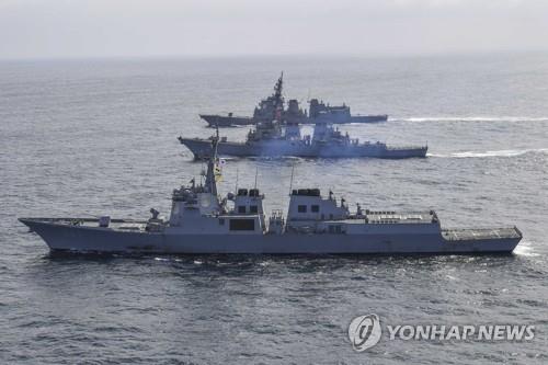 This file photo, released by the South Korean Navy on April 17, 2023, shows three Aegis-equipped destroyers -- South Korea's Yulgok Yi I (front), USS Benfold (C) and JS Atago of the Japan Maritime Self-Defense Force -- sailing off South Korea's east coast. (PHOTO NOT FOR SALE) (Yonhap)